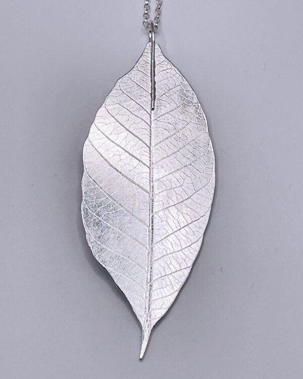 Large handmade leaf pendant made from 100% recycled sterling silver. It is a truly striking piece! The leaf is 8cm in length by approximately 3cm in width and it contains all the details of the veins on a real leaf. It comes on an 18 inch 1.7mm trace chain. The leaf is hallmarked.