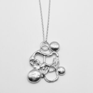 Unique handmade pendant with three balls of silver attached to silver wire,