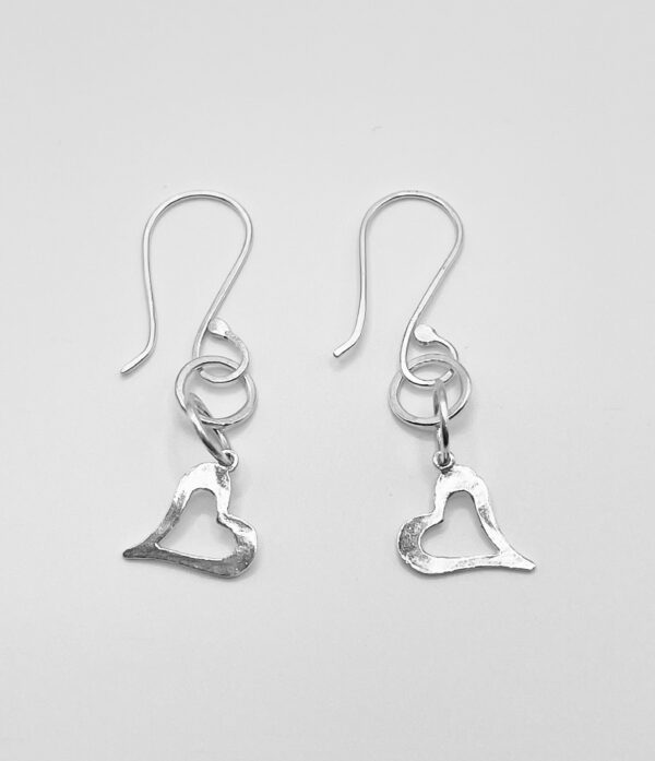 Pair of small heart earrings on handmade ear wires made from recycled sterling silver.